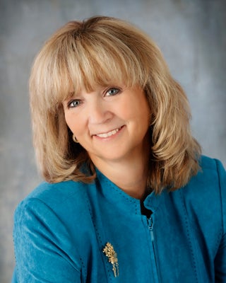 Portrait of Kim Blanton, REALTOR® Certified Residential Specialist.  Cell # 615-969-1460